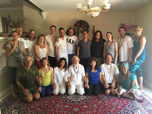 Acharya M. Govindan Satchidananda (kneeling, center), and to is right Acharya Shantiananda, along with participants 
              in the 2nd initiation and retreat in Redlands, California, July 29-31, 2016